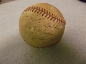 Baseball autographed by Yogi Berra. Courtesy of The Mariners’ Museum.