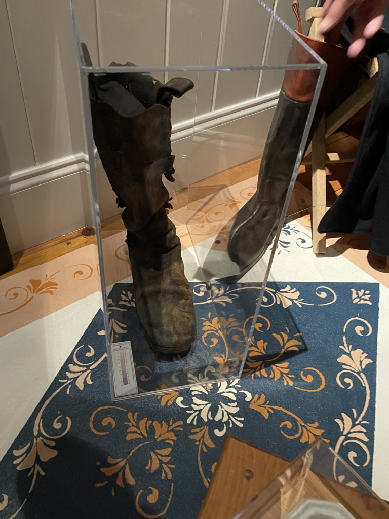 Boot on display showing it slumped inside its case.